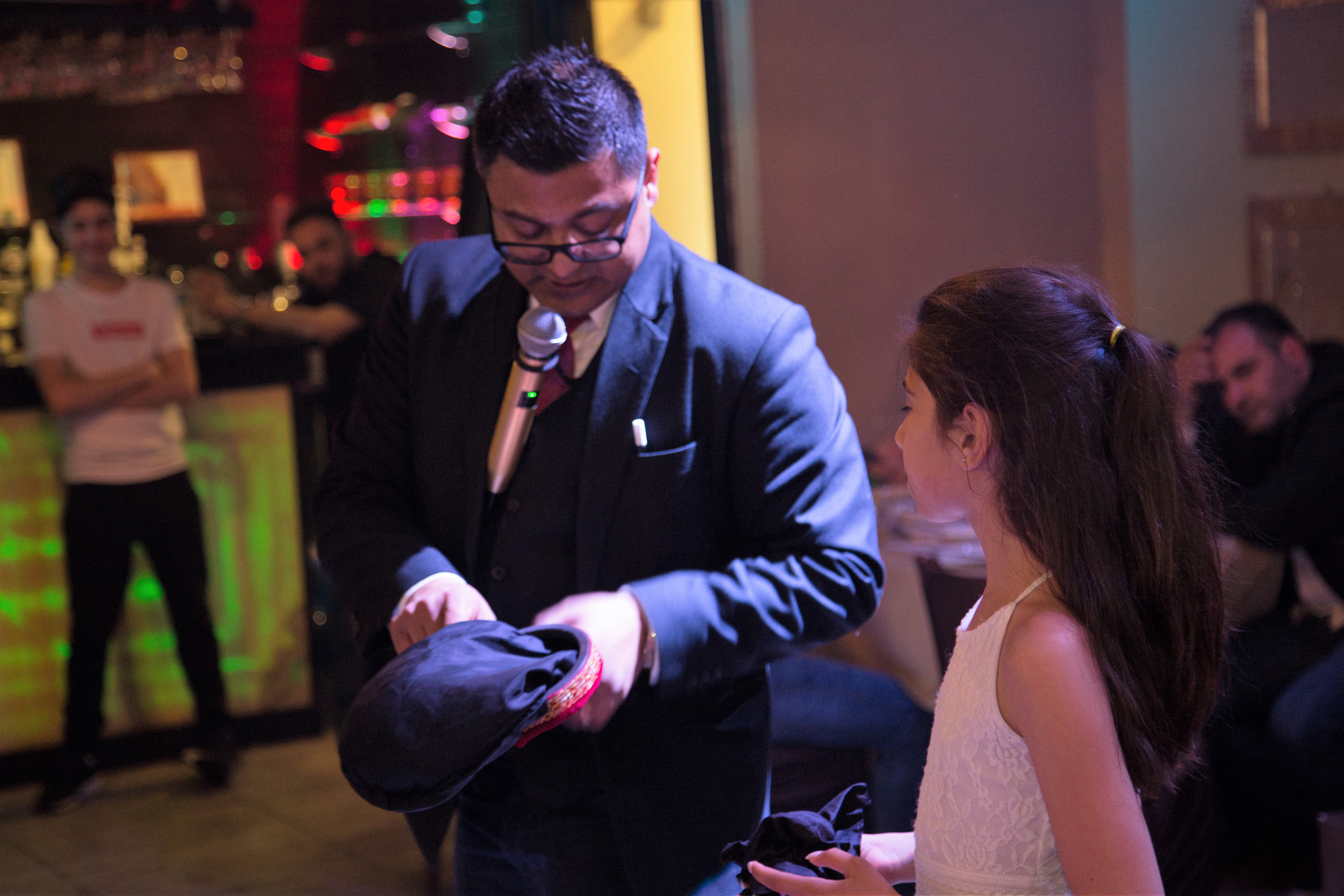 Close-up magic trick with a young guest